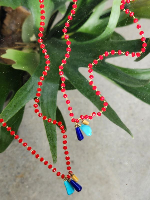 red crystal necklaces with plants