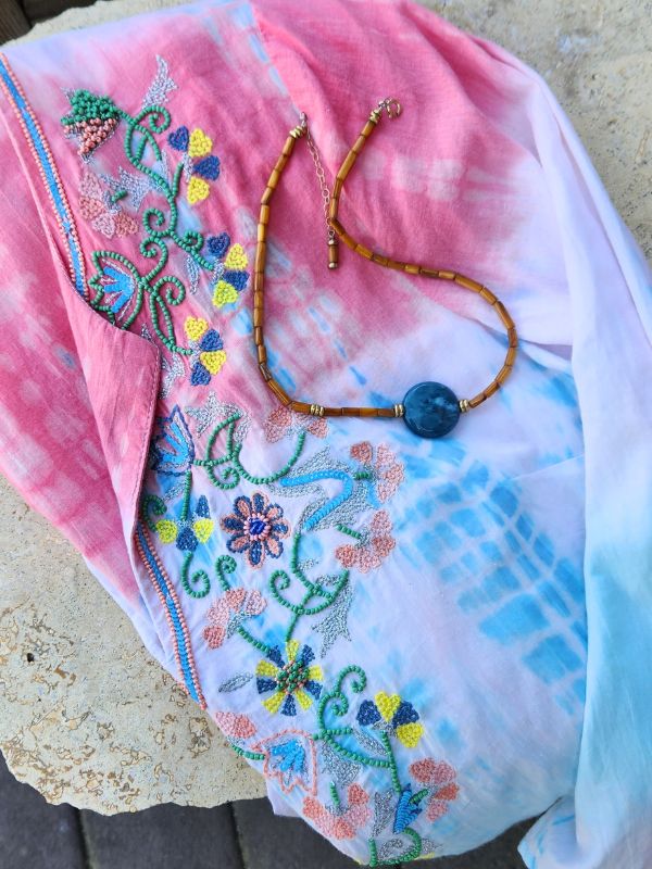 colorful top with colorful gemstone necklace