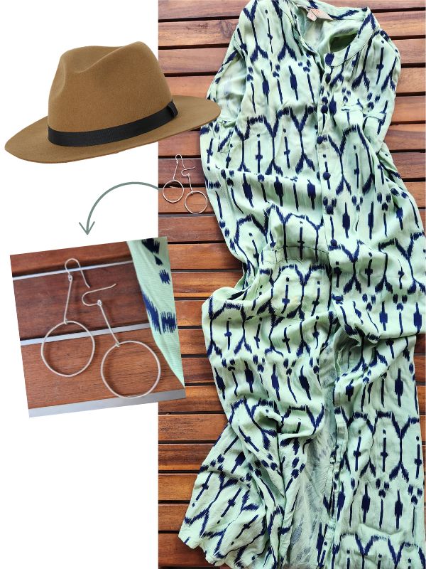 flatlay with long green kurta dress earrings hat