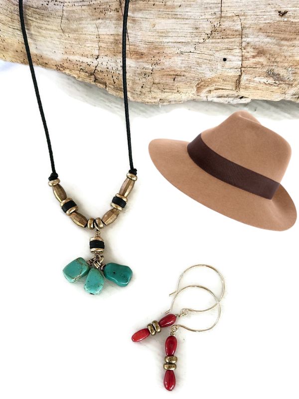 turquoise necklace coral earrings flat lay with hat