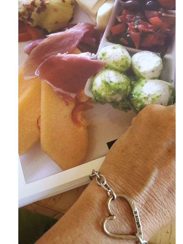 heat bracelet on wrist with appetizer tray of food