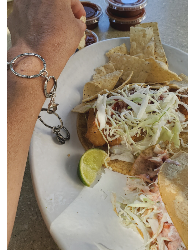silver circle bracelet and fish tacos