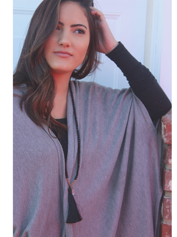 gray sweater long black necklace on model