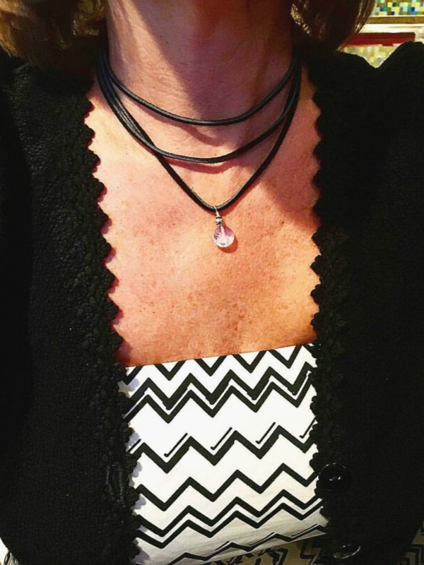 black suede necklace on neck and outfit