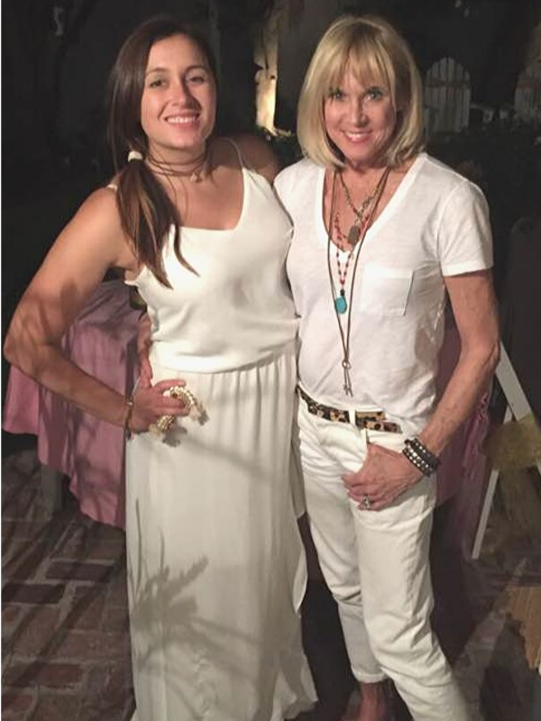 2 ladies in white with lots of jewelry