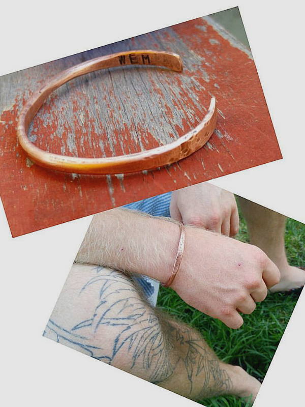 copper cuff on male with tatooed leg