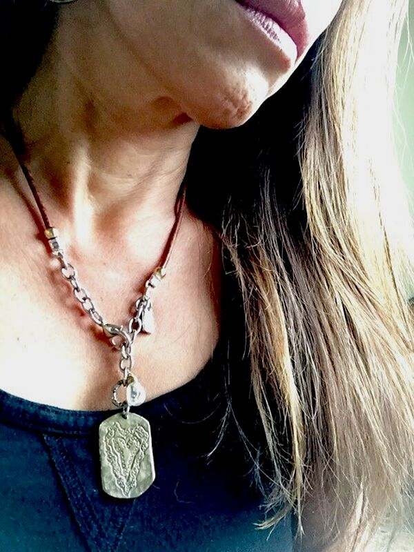 heart necklace with leather & chain on neck