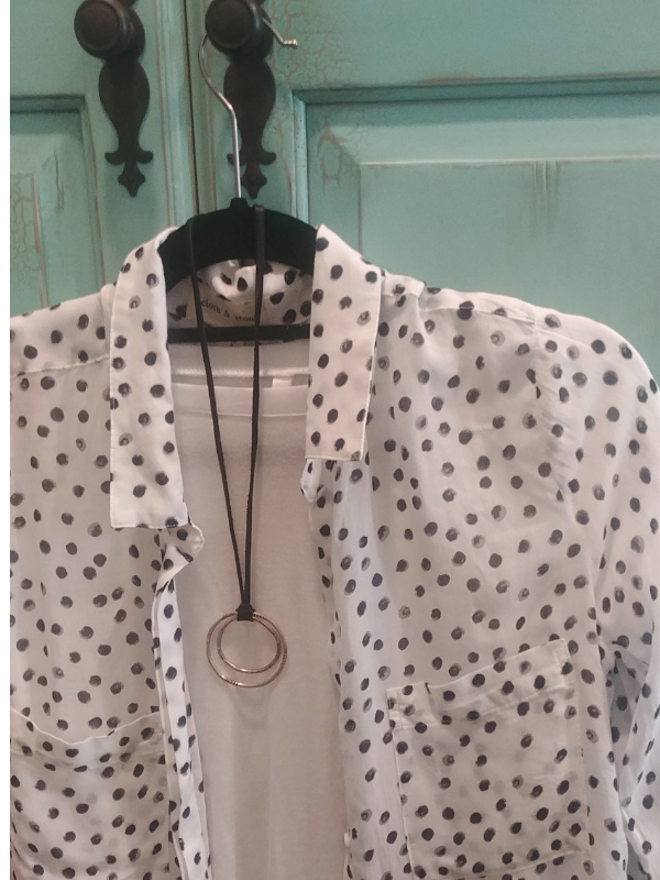 polka dot shirt and silver circle necklace