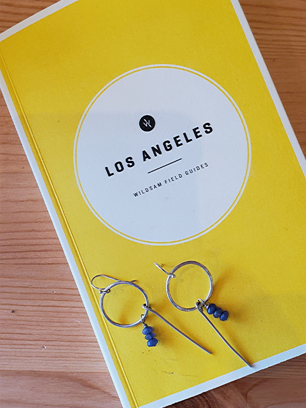 yellow LA guedebook with artisan earrings