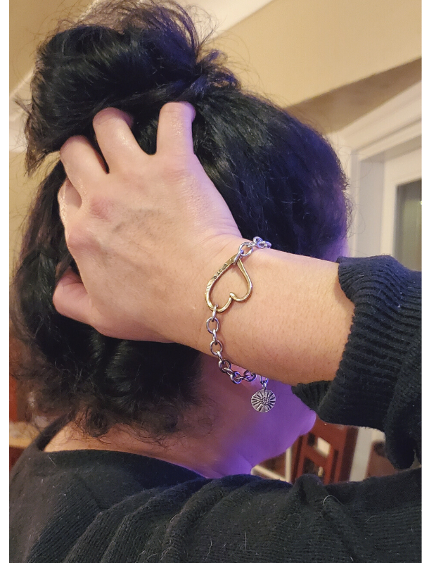 heart bracelet on hand in hair
